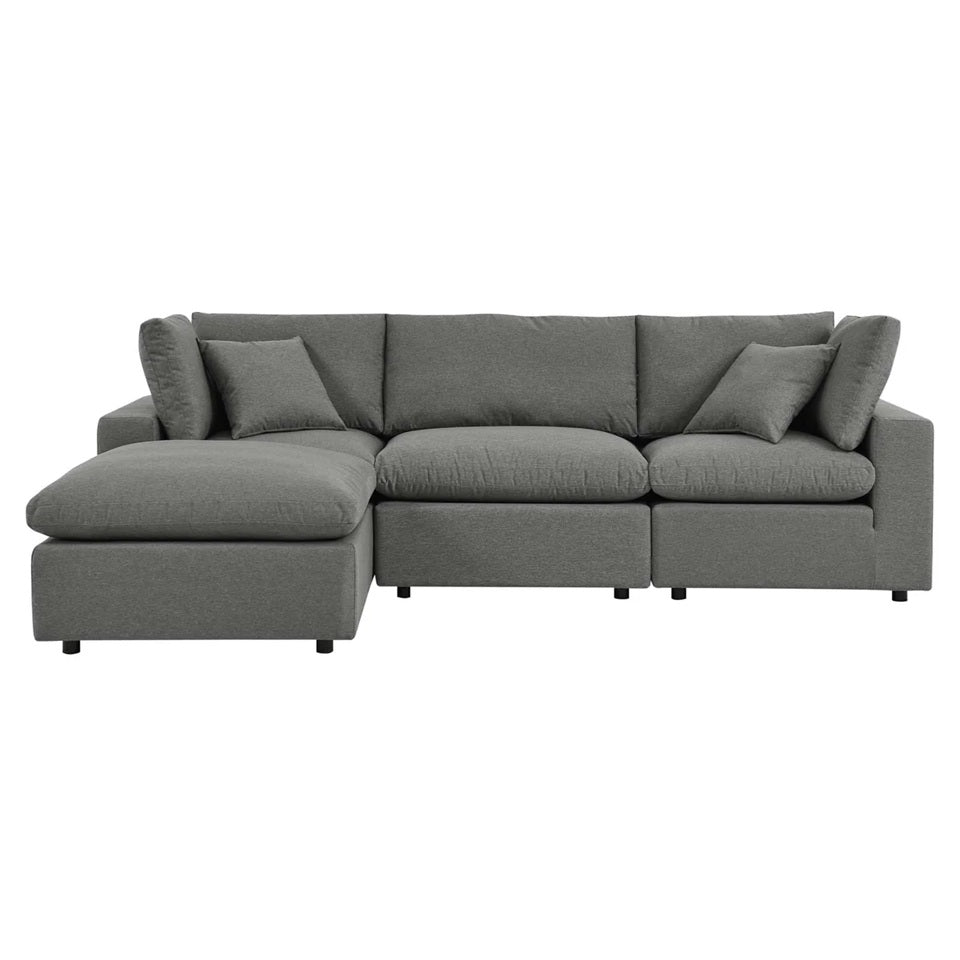 Gray 3-seater fabric sofa with matching ottoman set in open living space