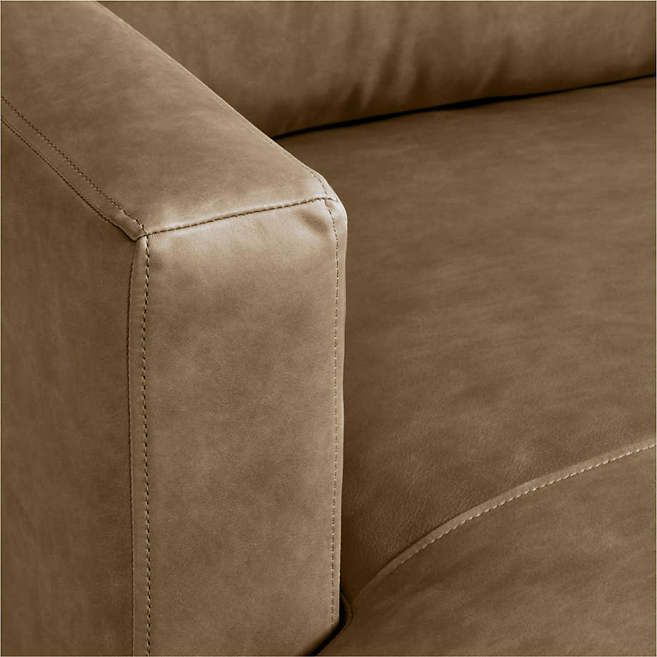 Brown leatherette sofa with clean lines in a compact living space
