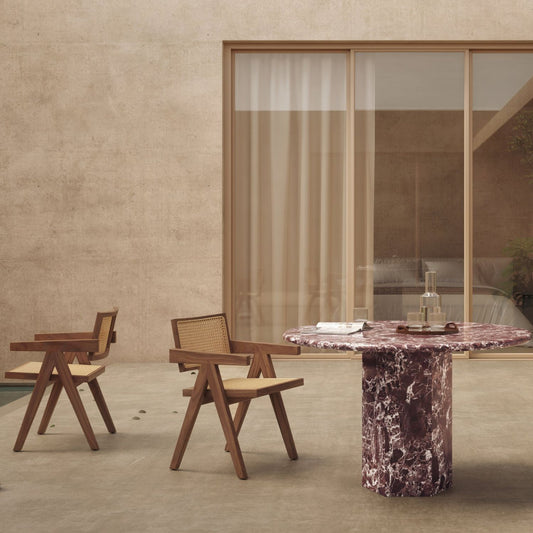 handcrafted traditional solid wood chairs with cane seat and backrest in an aesthetic dining room setup