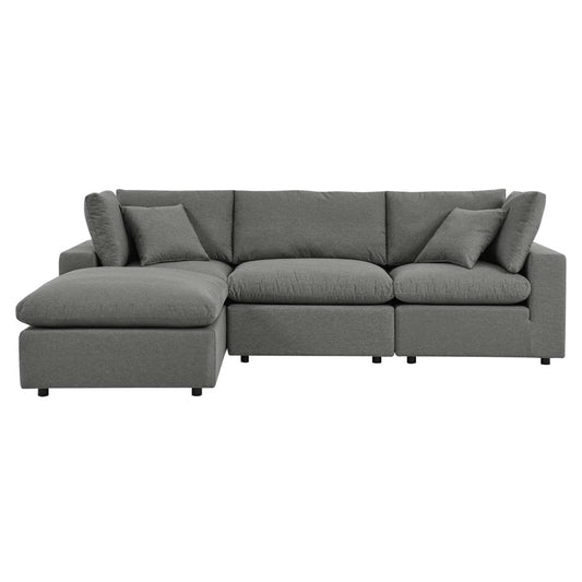 Gray 3-seater fabric sofa with matching ottoman set in open living space