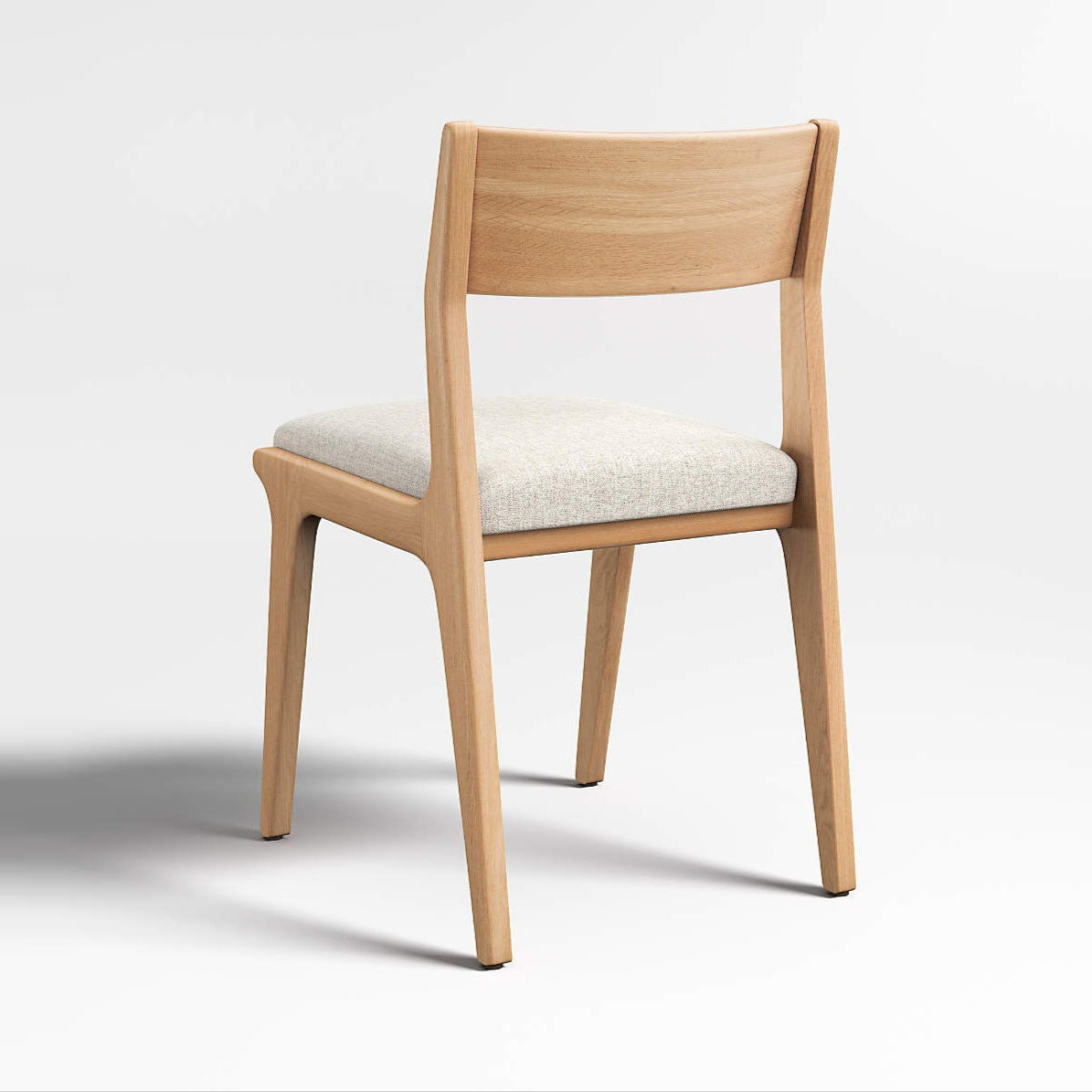 Comfortable modern dining chair with curved wooden back